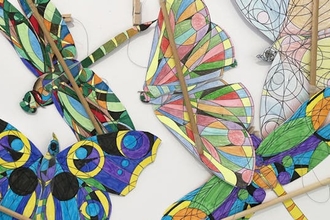 Picture of brightly coloured winged automata